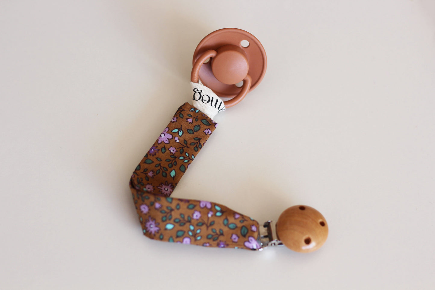 Cuelga chupete Bloom Malva